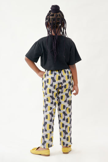 All Over Black And Yellow Wax Print Pant With Black Crop Top